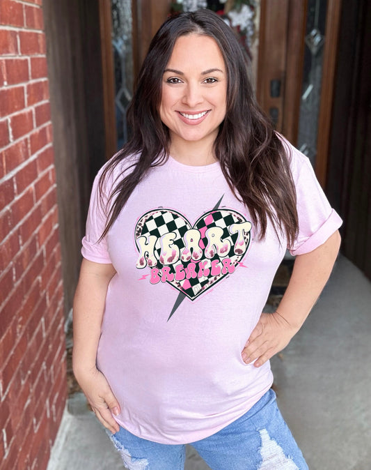 Get ready to break some hearts with our Heartbreaker Pink Graphic Tee! This stylish tee is sure to turn heads with its unique design and playful attitude. Made from high-quality materials, it's both comfortable and stylish. Don't be afraid to show off your playful and quirky side with this fun and flirty tee.
Unisex Fit , Available in Small to 4X