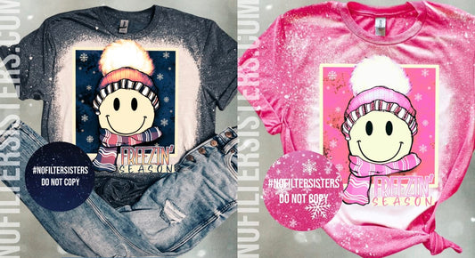 Stay cheerful in the cold with our 'Freezin Season Smiley Tee.' This unisex fit tee offers comfort and style