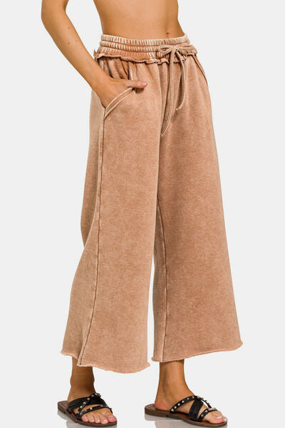 Acid Wash Fleece Wide Leg Pants, a new take on the timeless. Their acid wash finish brings vintage charm and edgy appeal to any outfit. Made from a premium leather fabric, these pants offer comfort and warmth, perfect for colder days